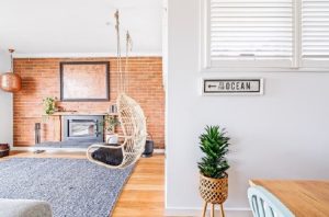 Matching brick wall and light hardwood floorboards