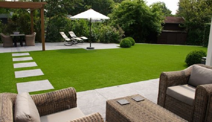 Artificial grass in the backyard seating area