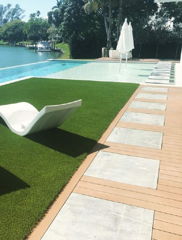 Pool with artificial grass and wooden deck