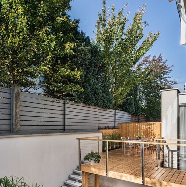 Wood Upper Deck on a Stone Patio
