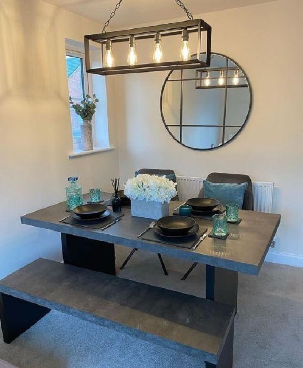 A stunning contrast ambience with a black concrete dining table