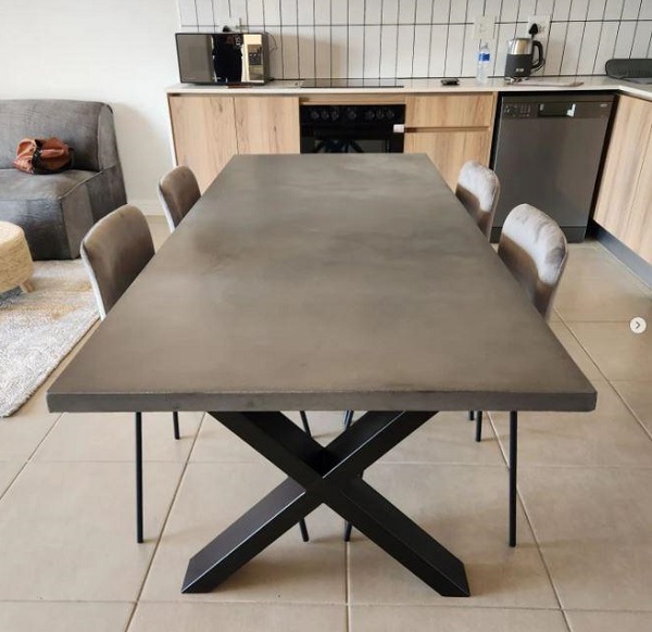 Matching black concrete dining table with room atmosphere