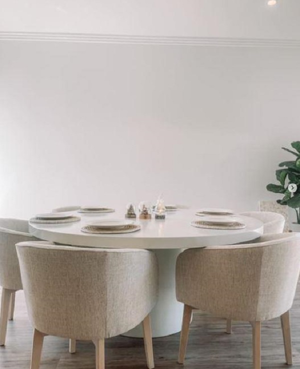 White elegant concrete dining table with comfy chair