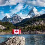 A Girl holding a Canadian national flag