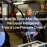 What must be done after recovering the liquid refrigerant from a low-pressure chiller?