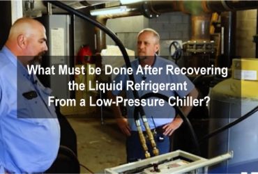 What must be done after recovering the liquid refrigerant from a low-pressure chiller?