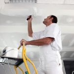 A painter is painting a room