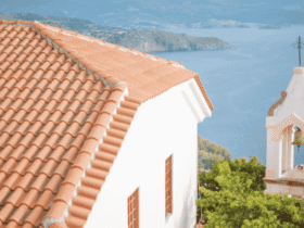 Durable terracotta tiled roof on a coastal building, used to illustrate Long Island roof replacement quality.